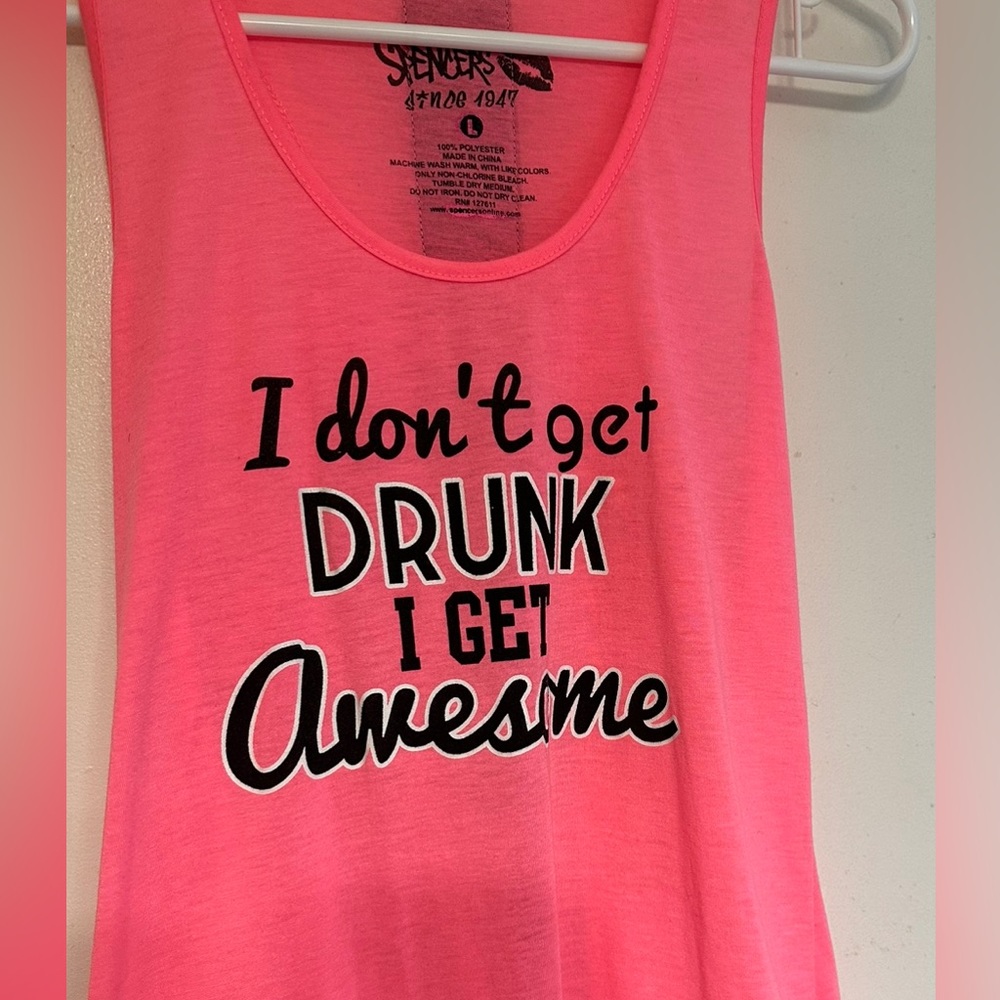 Women’s pink tank. “I don’t get drunk I get awesome”